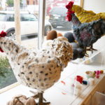 Three chicken footstools adorn the studio window