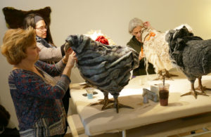 Women work on chicken footstools