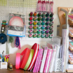 Notions, thread and a pile of books in Tula Pink's studio.