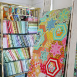 A quilt that features Tula Pink's Tabby Road fabric collection.