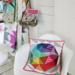 A chair holds a Tula Pink pillow pattern in a corner of her office.