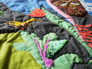 Detail of Nedra's quilt, Spirits of the Forest.
