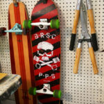 Skateboards hang next to tools in Seth Smith's studio.