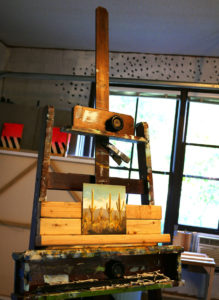 An in-progress painting sits on an easel in artist Seth Smith's studio.