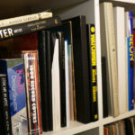 A variety of books in Seth Smith's studio library.