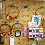 Undecorated wreaths hang in Grace D. Chin's studio.