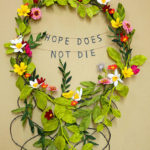 Hope Does Not Die, a paper floral wreath by Grace D. Chin.