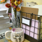 A colorsplashed mug and flowers brighten a corner of Grace D. Chin's studio.