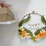 A floral wreath that features local band Varma Cross.