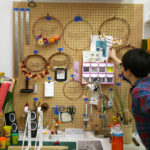 Grace D. Chin straightens the supplies in her studio.