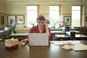 Lizzy House in her workspace. Photo by Lizzy House.