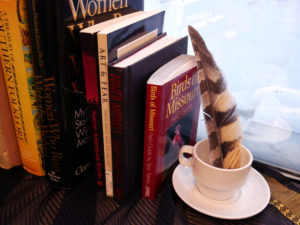 Books stacked on the window ledge in Jillian's studio.