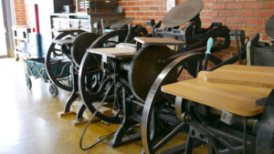 A line of letterpress machines in the Two Tone Press studio.